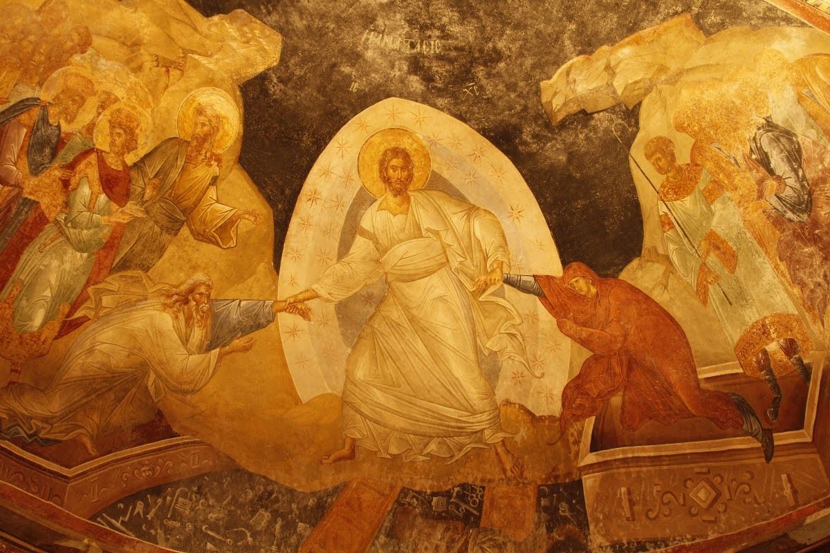 Byzantine fresco of the Resurrection: radiant Christ stands central, raising figures from darkness amid angels, saints, and golden robes.